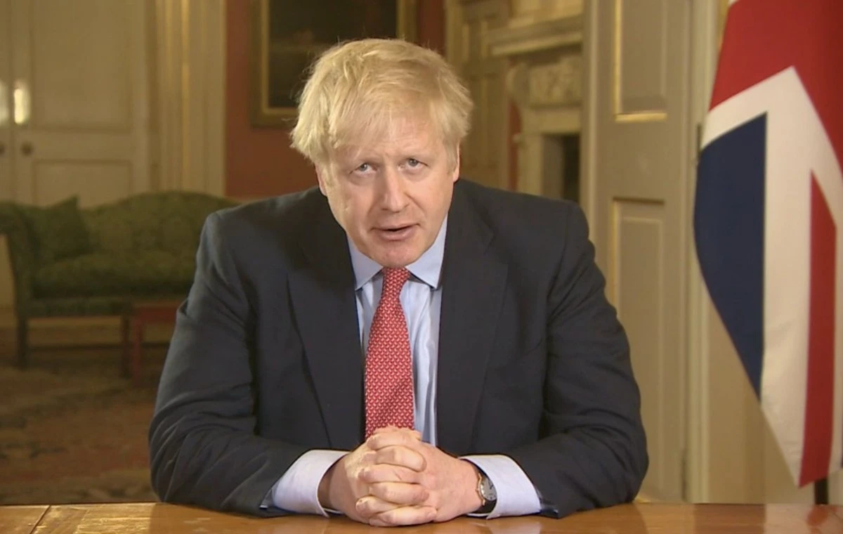 British Prime Minster Boris Johnson has ordered the closure of most retail stores and banned gatherings for three weeks in a stepped-up response to slow the new coronavirus. (Screenshot/BBC)
