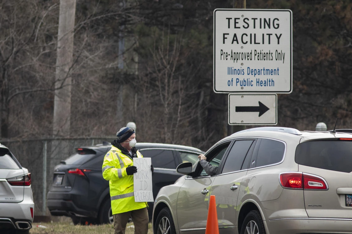 Cars wait in line for a COVID-19 drive-thru test site for medical personnel and first responders operated by the Illinois National Guard on Tuesday, March 24, 2020 in Chicago. (AP)