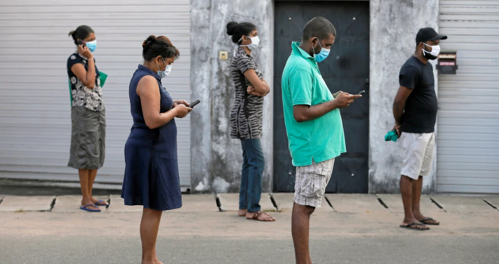 People maintain the one-meter distance in-between each other in Colombo. (Reuters)