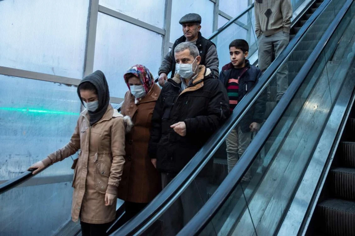 People wear face masks to protect against the coronavirus in Rasht, Gilan province, Iran. (Shutterstock)