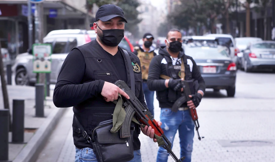 Officers on a street in Beirut to prevent the spread of the infection (AP)