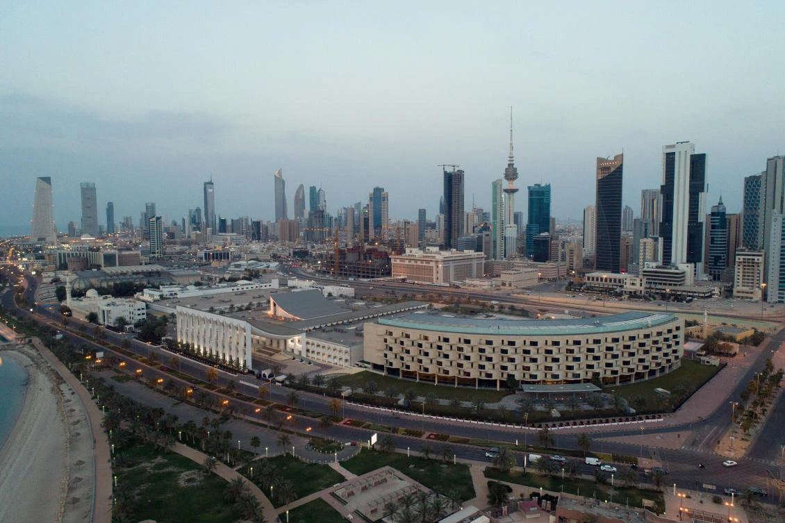 Oil prices fell as with the collapse of a global oil supply cut pact and the spread of the coronavirus, which has hit demand. Above the Kuwaiti skyline. (Reuters)