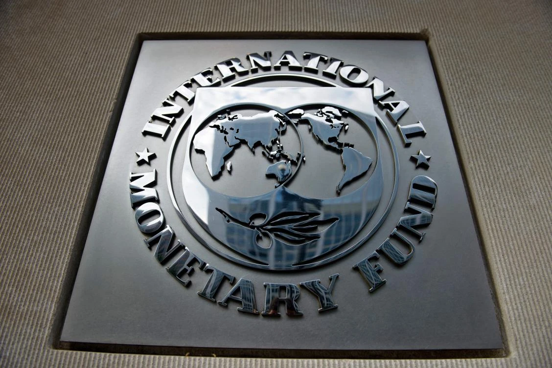 In this file photo taken on June 30, 2015 a logo is seen outside the headquarters of the International Monetary Fund in Washington, DC. (AFP)