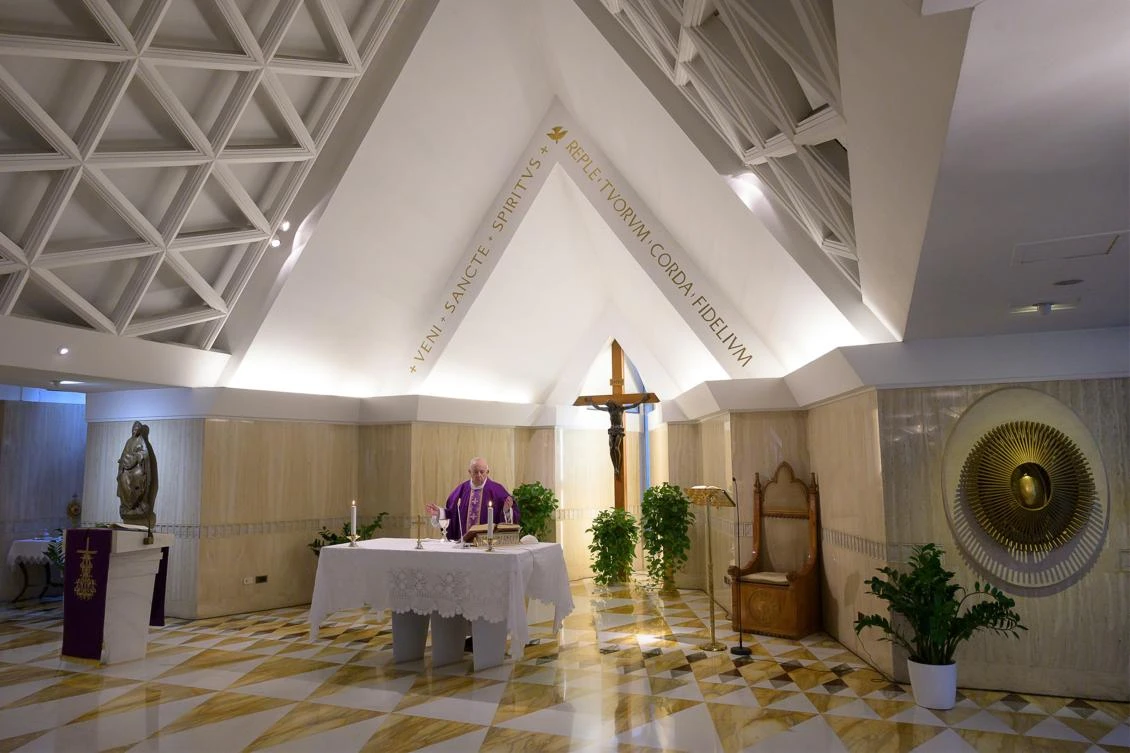 This photo taken and handout on March 23, 2020 by the Vatican Media shows Pope Francis celebrating a private morning mass broadcast from the Santa Marta chapel in the Vatican, during the COVID-19 new coronavirus pandemic. (AFP)