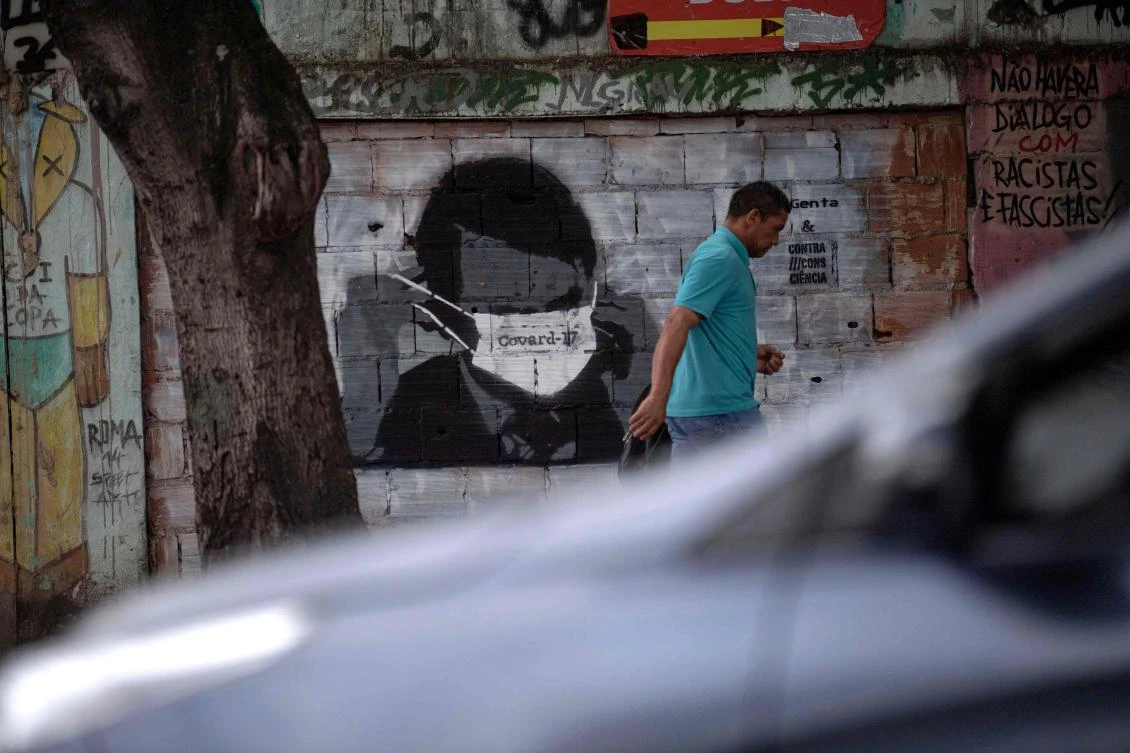 Brazilian President Jair Bolsonaro has clashed with local authorities who have closed schools and businesses in a bid to contain the spread of the new coronavirus. (AFP)