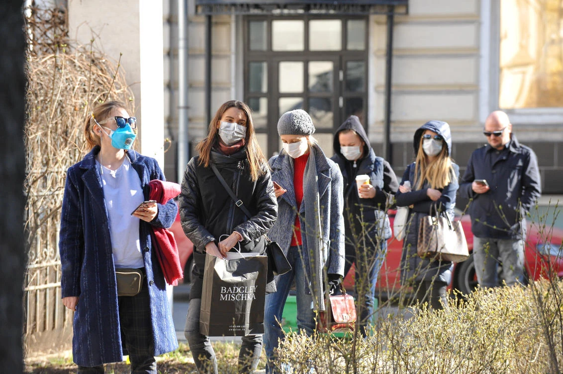 People queue before undergoing medical tests for coronavirus disease at a laboratory in Moscow on March 26, 2020. (Moscow News Agency via Reuters)