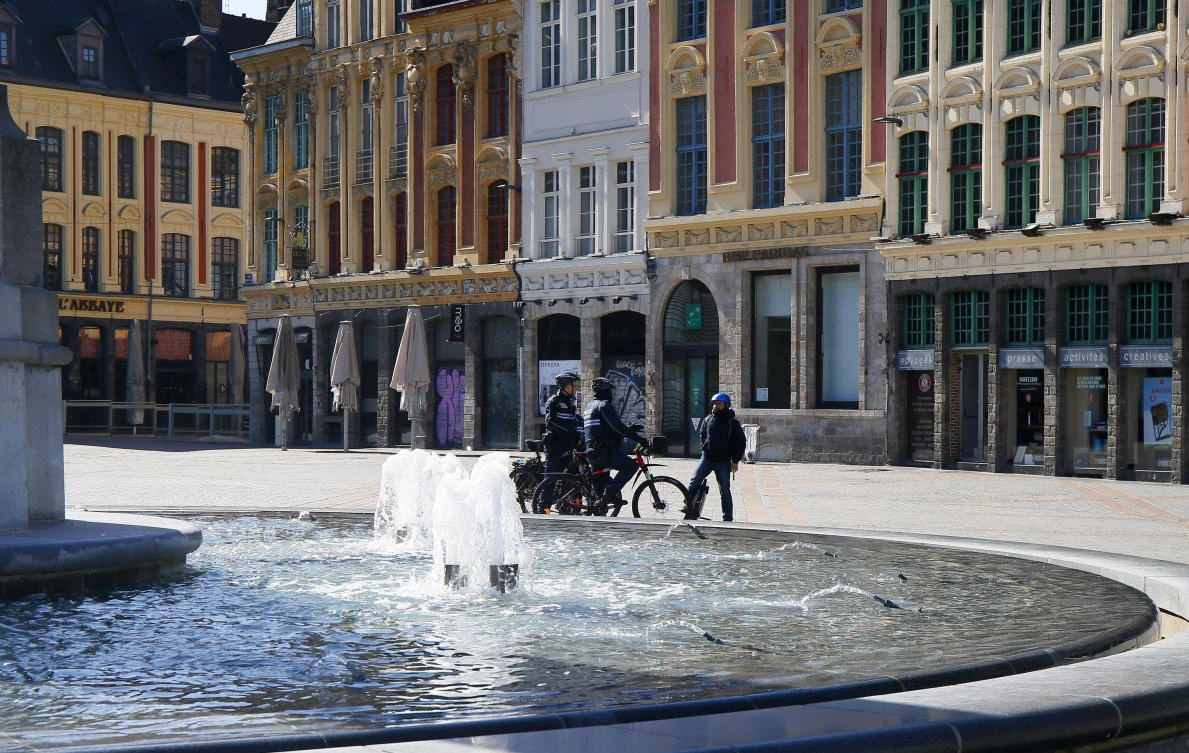 French police officers control residents in Lille, northern France Tuesday, March 24, 2020. (AP/Michel Spingler)