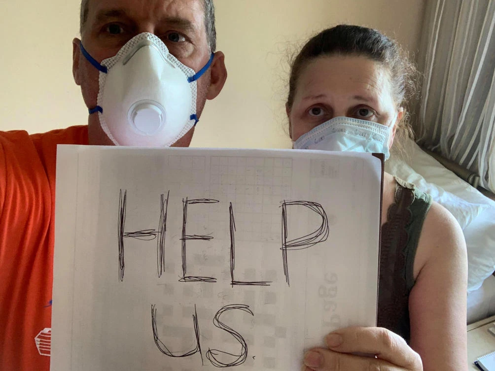 Canadian passengers Chris and Anna Joiner ask for help onboard the MS Zaandam, off the coast of Panama. (Reuters)