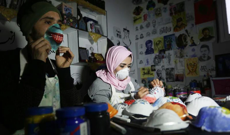 The idea of drawing on the masks came to the artists in Palestine because of the limited number of people who were wearing them in the Gaza Strip. (Supplied)