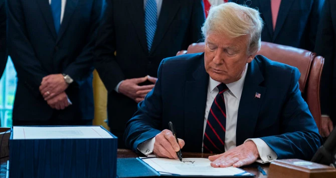 US President Donald Trump signed into law Friday the $2 trillion rescue plan to salvage a US economy. (AP)