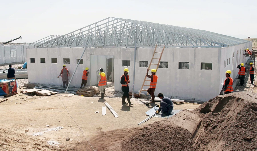 Construction workers on the site of a new 100-bed hospital for COVID-19 patients in Herat. (Reuters)