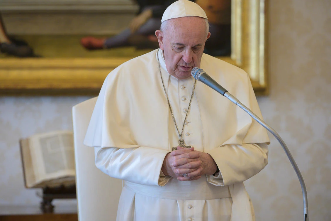 Pope Francis speaks during his general audience as it is streamed via video over the internet from a library inside the Vatican, March 25, 2020. (Reuters)