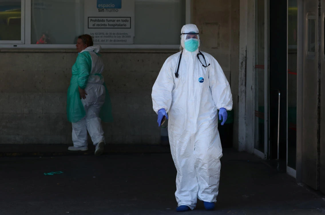 A health care worker is seen near the emergency unit at 12 de Octubre hospital during the coronavirus disease (COVID-19) outbreak in Madrid, Spain March 28, 2020. (Reuters)