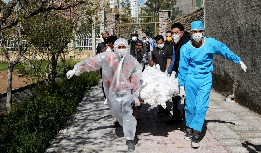 Medical staff transfer a patient with coronavirus disease (COVID-19) to Masih Daneshvari Hospital, in Tehran, on Monday. (Reuters)