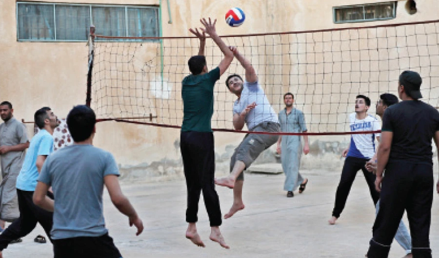 Prisoners play volleyball on April 3, 2018 in a Kurdish-run prison housing former Daesh militants in Qamishli, northern Syria. (Reuters)