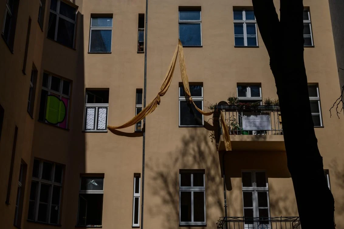 An art installation, part of the "Balconies, Life, Art, Pandemic, and Proximity" exhibition, is seen in Berlin on April 12, 2020, amid a new coronavirus COVID-19 pandemic. Over 30 artists are taking part in the two-day exhibition which calls on "the artistic community living in [Berlin's district of] Prenzlauer Berg to activate / exhibit / inhabit / their windows and balconies on Easter Sunday and Monday". Curated by Ovul Durmusoglu and Joanna Warsza, the exhibition boasts "zero budget, no openings, no crowds, just a proposition of a stroll that would connect dots in solidarity and togetherness". / AFP / John MACDOUGALL