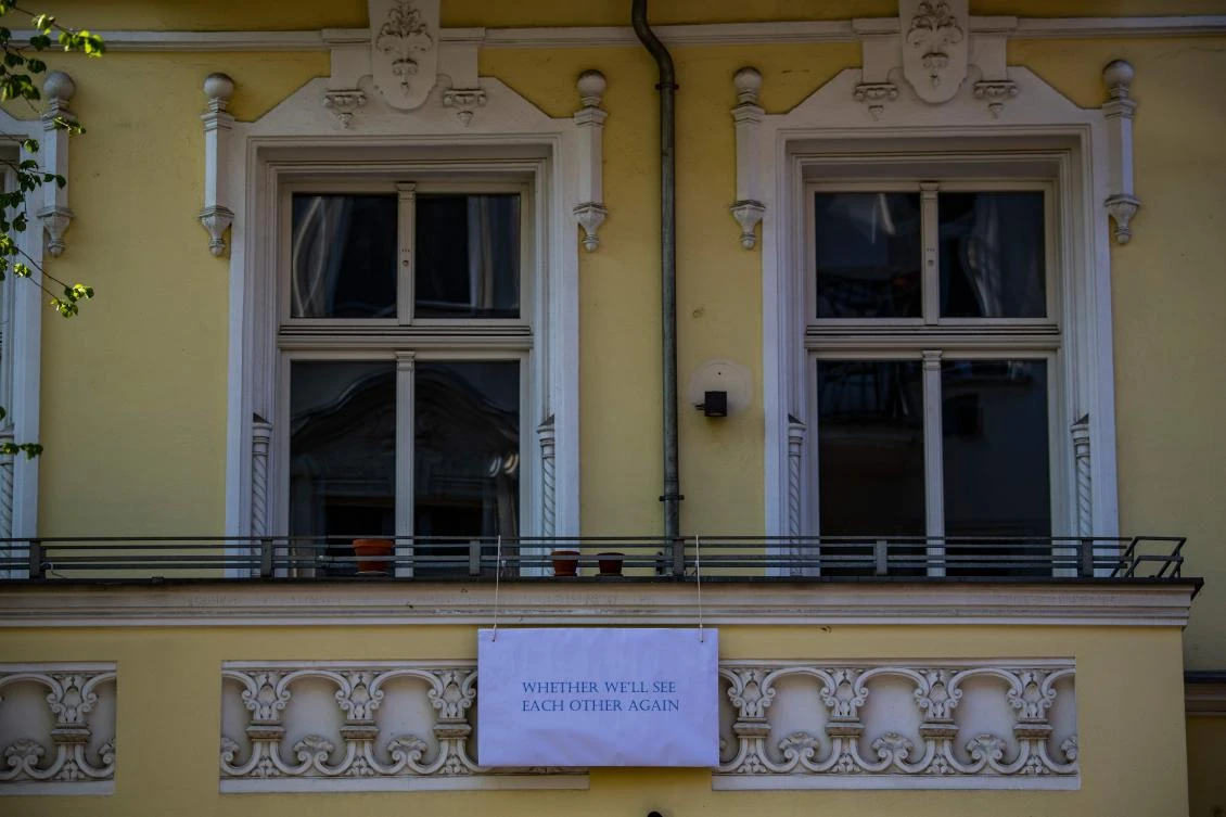 An art installation featuring a sign reading: "Whether we'll see each other again", part of the "Balconies, Life, Art, Pandemic, and Proximity" exhibition, is seen in Berlin on April 12, 2020, amid a new coronavirus COVID-19 pandemic. Over 30 artists are taking part in the two-day exhibition which calls on "the artistic community living in [Berlin's district of] Prenzlauer Berg to activate / exhibit / inhabit / their windows and balconies on Easter Sunday and Monday". Curated by Ovul Durmusoglu and Joanna Warsza, the exhibition boasts "zero budget, no openings, no crowds, just a proposition of a stroll that would connect dots in solidarity and togetherness". / AFP / John MACDOUGALL