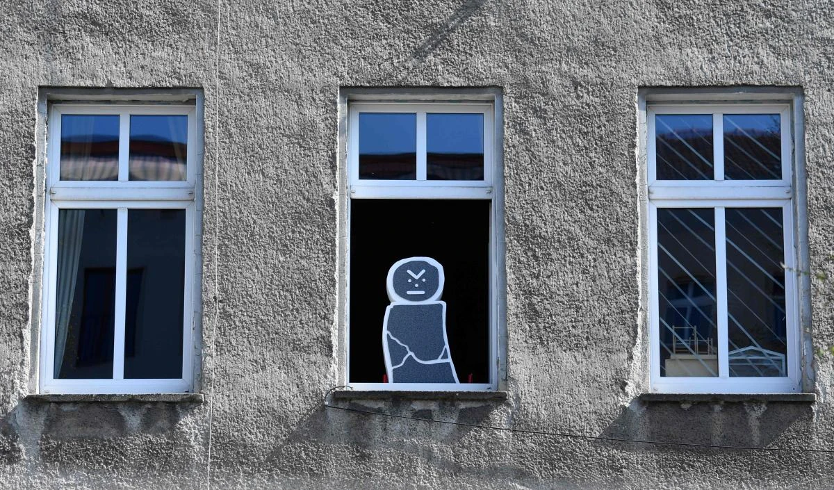 An art installation, part of the "Balconies, Life, Art, Pandemic, and Proximity" exhibition is seen in Berlin on April 12, 2020, amid a new coronavirus COVID-19 pandemic. Over 30 artists are taking part in the two-day exhibition which calls on "the artistic community living in [Berlin's district of] Prenzlauer Berg to activate / exhibit / inhabit / their windows and balconies on Easter Sunday and Monday". Curated by Ovul Durmusoglu and Joanna Warsza, the exhibition boasts "zero budget, no openings, no crowds, just a proposition of a stroll that would connect dots in solidarity and togetherness". / AFP / John MACDOUGALL