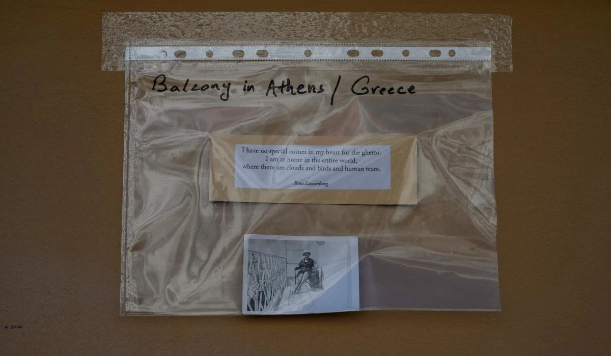 An art installation featuring a photograph of a balcony in Athens and a quote by Rosa Luxemburg, part of the "Balconies, Life, Art, Pandemic, and Proximity" exhibition, is seen in Berlin on April 12, 2020, amid a new coronavirus COVID-19 pandemic. Over 30 artists are taking part in the two-day exhibition which calls on "the artistic community living in [Berlin's district of] Prenzlauer Berg to activate / exhibit / inhabit / their windows and balconies on Easter Sunday and Monday". Curated by Ovul Durmusoglu and Joanna Warsza, the exhibition boasts "zero budget, no openings, no crowds, just a proposition of a stroll that would connect dots in solidarity and togetherness". / AFP / John MACDOUGALL