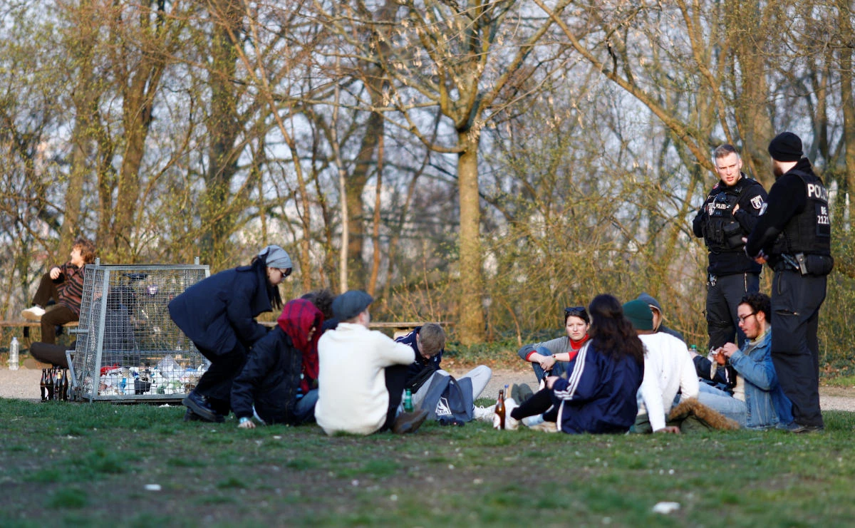 Police officers ask people to disperse as they gather at a park in Berlin on March 28, 2020 as the spread of the coronavirus disease continues in Germany. (Reuters)