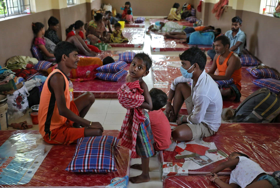 Homeless people rest after they were shifted by municipal officials to a government-run shelter during a 21-day nationwide lockdown to limit the spreading of the coronavirus disease (COVID-19), in Kolkata, India, March 30, 2020. (Reuters)
