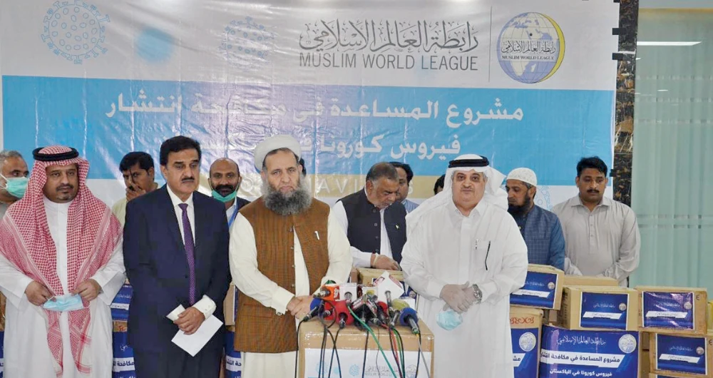 Saudi Ambassador Nawaf bin Said Al-Malki and Pakistan’s Religious Affairs Minister Noor-ul-Haq Qadri speak in Islamabad on Wednesday. (SPA)
