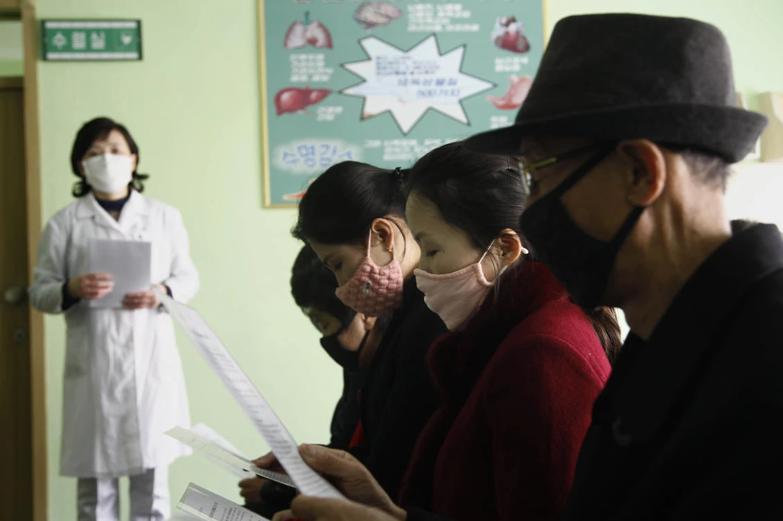 People review information explaining the coronavirus at the Phyongchon District People’s Hospital in Pyongyang, North Korea on Wednesday, April, 1, 2020. (AP)