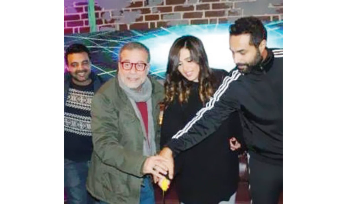Sherif Mounir and Yasmine, center, were set to work in a series that has been postponed. (Social media)