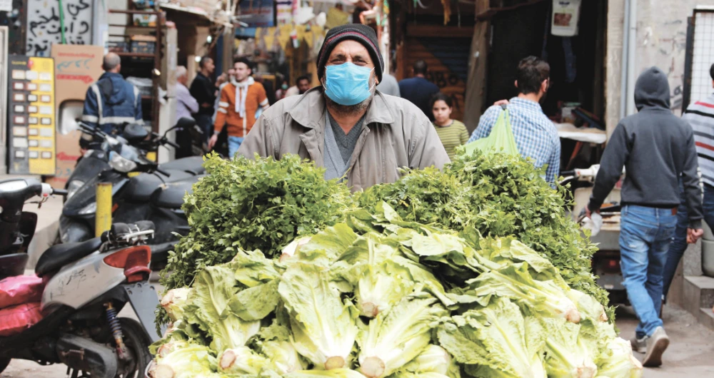 A street vendor pushes his cart in the Shatila Palestinian refugee camp in the Beirut suburbs. (Reuters)