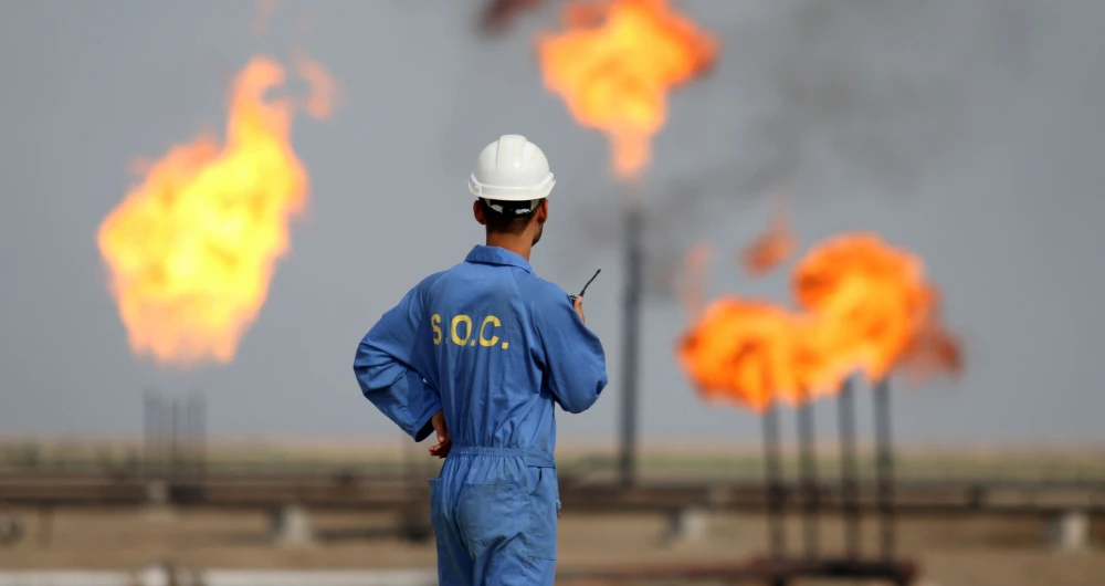 Iraq pays international oil companies (IOCs) about $3 billion quarterly to extract its crude. (AFP)