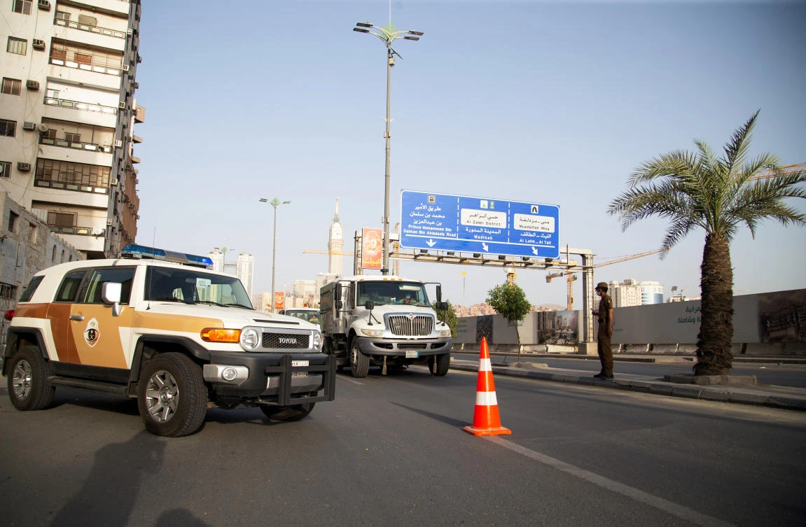 A policeman blcoks the road during a curfew imposed to prevent the spread of the coronavirus disease (COVID-19), in the holy city of Makkah, Saudi Arabia April 2, 2020. (Reuters)