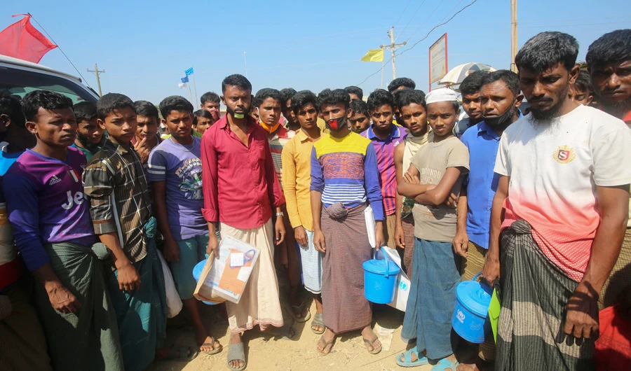 In this Wednesday, April 1, 2020, photo, Rohingya refugees stand at the Kutupalong refugee camp, Coxs Bazar, Bangladesh. (AP)