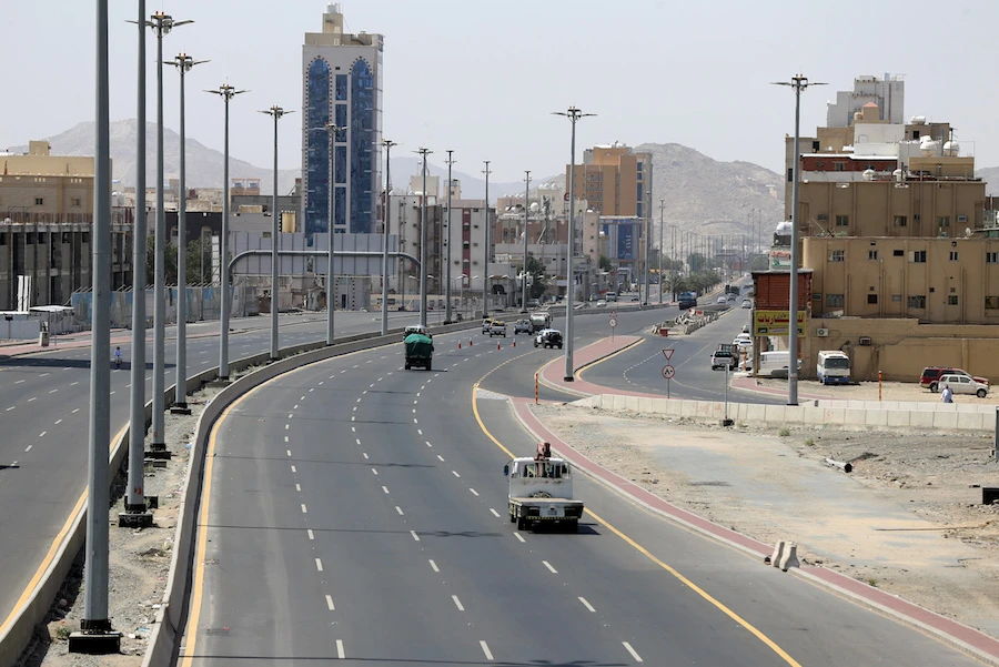 Cars drive on a street in Saudi Arabia's holy city of Mecca on April 3, 2020. (AFP)