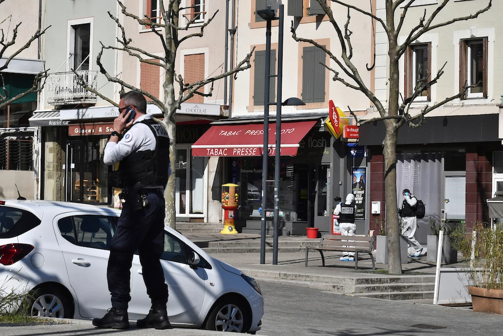 Police at the scene of the attack in Romans-sur-Isere, southern France. (AP)