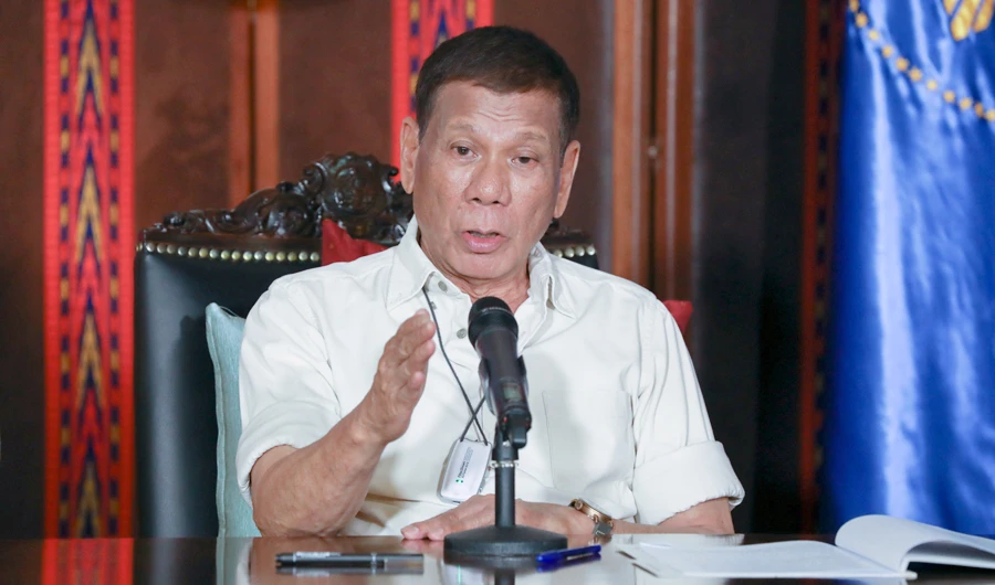 In this Friday, April 3, 2020, photo provided by the Malacanang Presidential Photographers Division, Philippine President Rodrigo Duterte speaks during a late night live broadcast in Malacanang, Manila, Philippines. (AP)