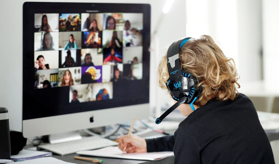A Spanish student takes online classes at home using Zoom. The app has become the ‘go-to’ service for education, exercise classes and even church services. (Reuters)