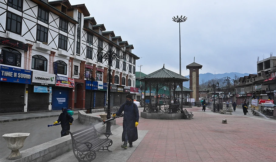 Municipal workers spray disinfectant on a square during a government-imposed nationwide lockdown as a preventive measure against the COVID-19 coronavirus in Srinagar on March 30, 2020. (AFP)