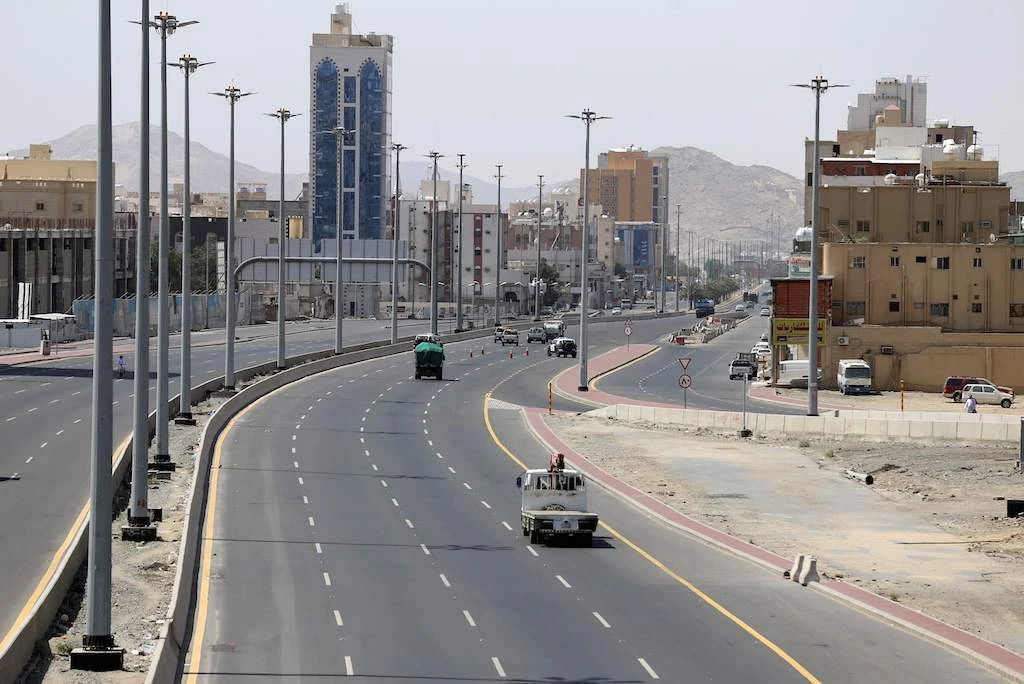 Cars drive on a street in Saudi Arabia's holy city of Mecca on April 3, 2020. (AFP)