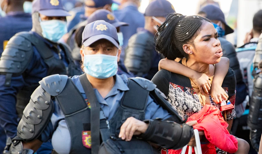 Police remove foreign migrants from the Central Methodist Church in Cape Town, Sourth Africa, Thursday, April 2, 2020. (AP)