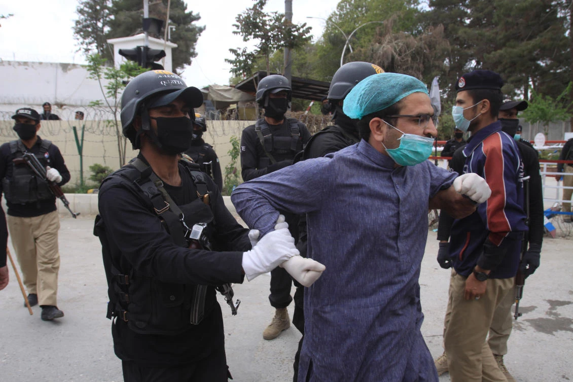 Police arrest doctors demanding facilities and prevention kits to attend coronavirus patients in Quetta, Pakistan on Monday, April 6, 2020. (AP)