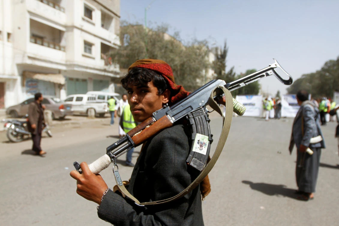 A Houthi supporter looks on as he carries a weapon during a gathering in Sanaa. The Iranian-backed Houthi militia have been blamed for an attack on a woman's jail which killed six women and a child. (Reuters/File Photo)