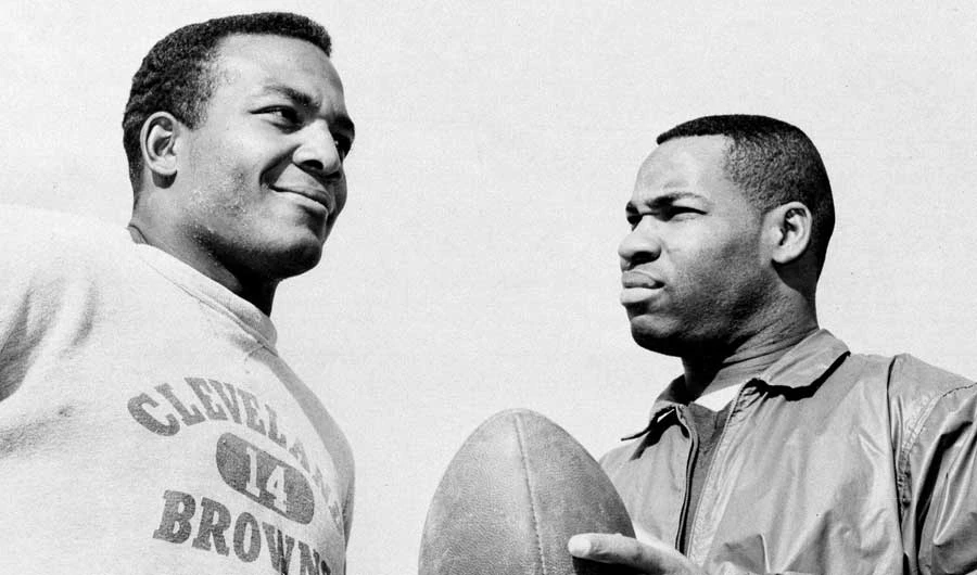In this Jan. 11, 1964, file photo, fullback Jim Brown, left, with flanker back Bobby Mitchell, once a feared duo for the Cleveland Browns before Mitchell was dealt to Washington. (Files/AP)