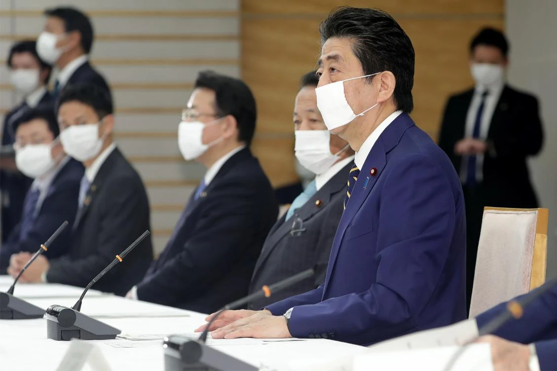 Japanese Prime Minister Shinzo Abe on Tuesday declared a state of emergency to fight new coronavirus infections in major population centers. (Jiji Press/AFP)