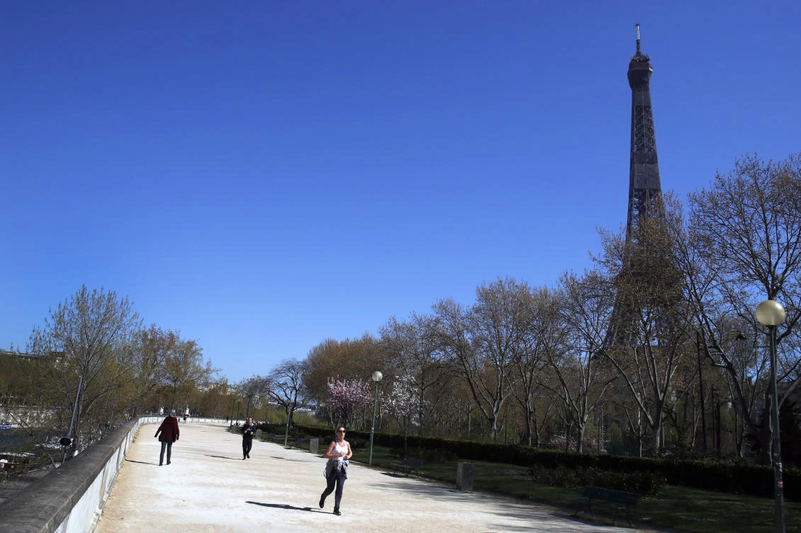Paris bans daytime jogging as virus deaths hit new high