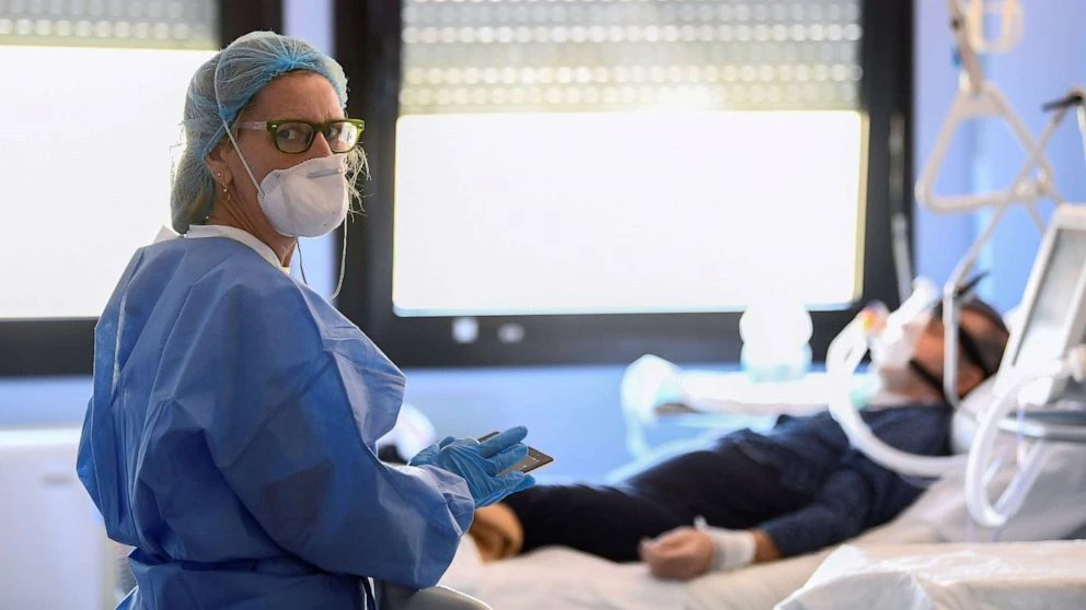 A medical worker wearing a protective mask and suit looks on as she treats a patient suffering from coronavirus disease (COVID-19) in an intensive care unit at the Oglio Po hospital in Cremona, Italy,. (Reuters/File Photo)