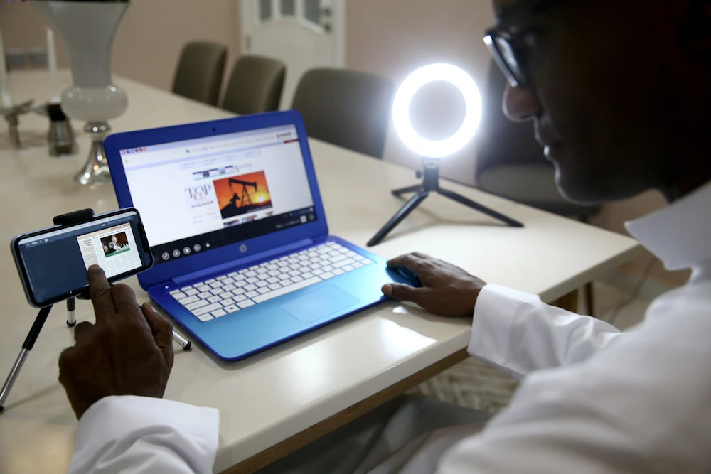 The use of technology, allowing journalists to edit and produce daily stories remotely, helps during the coronavirus curfew and restrictions. (AN Photo/ Ahmed Fathi)