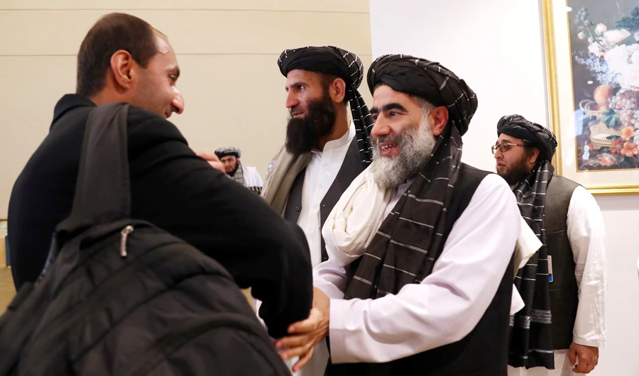 Members of Afghanistan's Taliban delegation gather ahead of an agreement signing between them and U.S. officials in Doha, Qatar, February 29, 2020. (REUTERS)