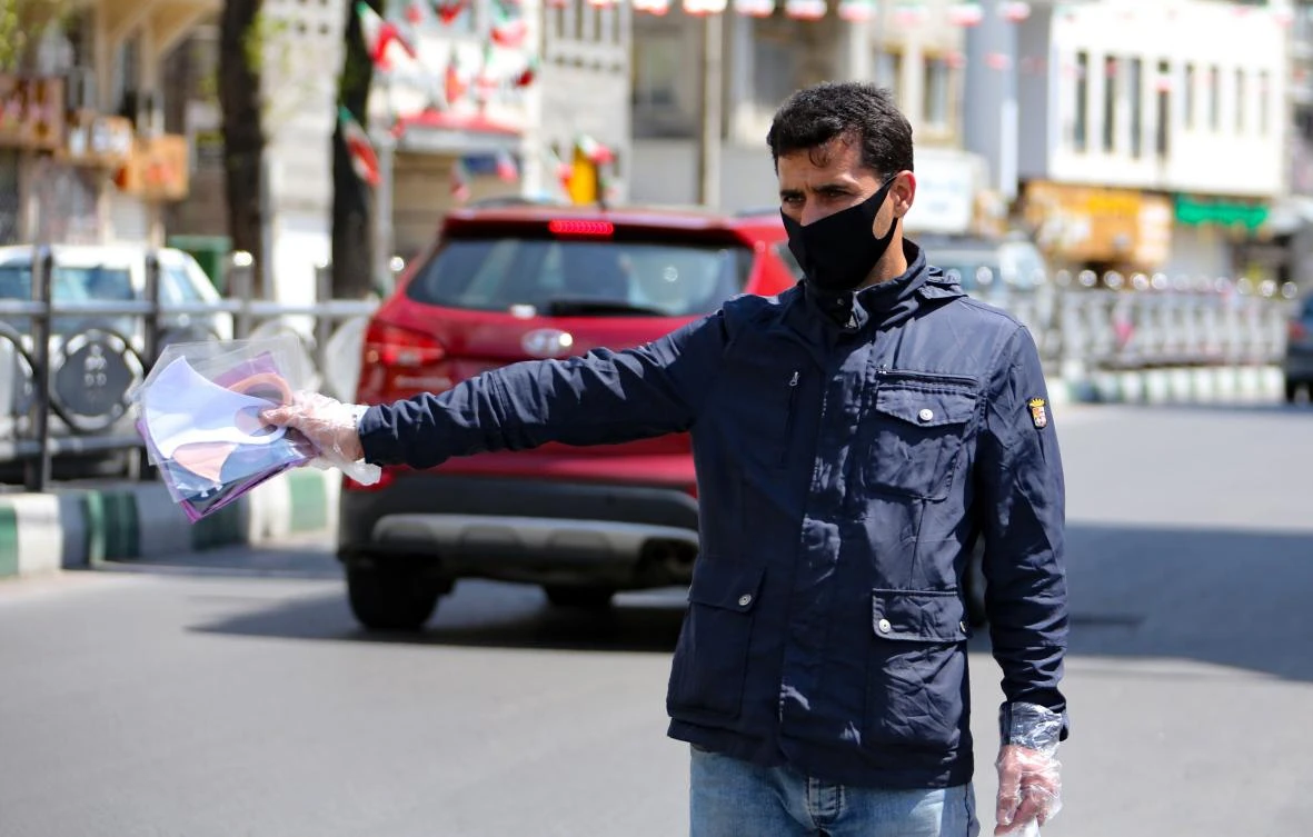 A man sells face masks on a street in the Tehran on April 5, 2020. The total number of infections in Iran has risen to 67,286 as of Wednesday, April 8, 2020. (AFP)