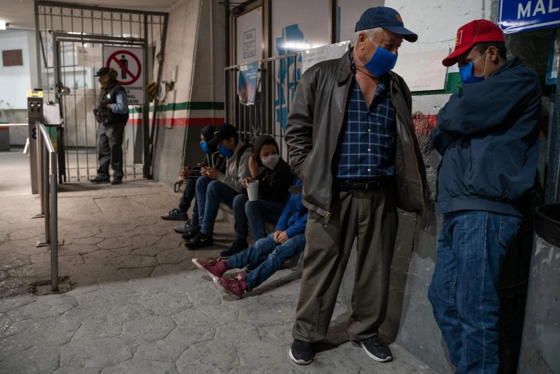 The US government used an obscure public health law to justify one of its most aggressive border crackdowns ever. Above, migrants wait to enter the Paso del Norte International Bridge in Chihuahua, Mexico. (AFP)