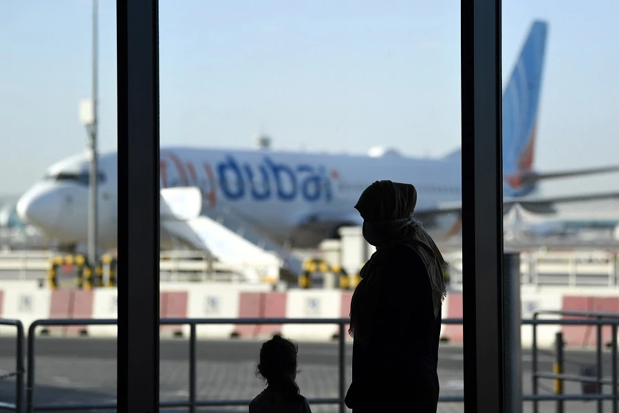 A Flydubai aircraft is parked on the tarmac of Dubai International Airport, on April 6, 2020. (File/AFP)